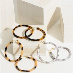 Light weight resin hoop earring. Approximately 2” in length.